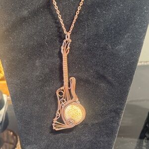 Hand Crafted Copper-Tone Wire Guitar Pendant with Fossilized Coral Stone